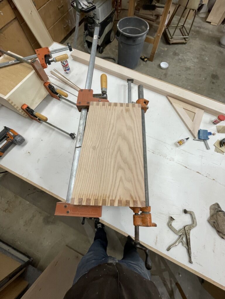 Dovetailed panel clamped on the bench