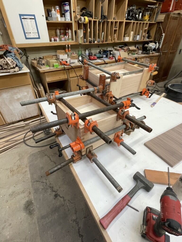 Cabinet boxes in clamps during glue-up