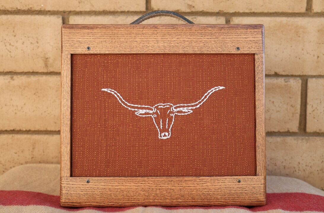 Cabinet with rust grill cloth and an embroidered longhorn