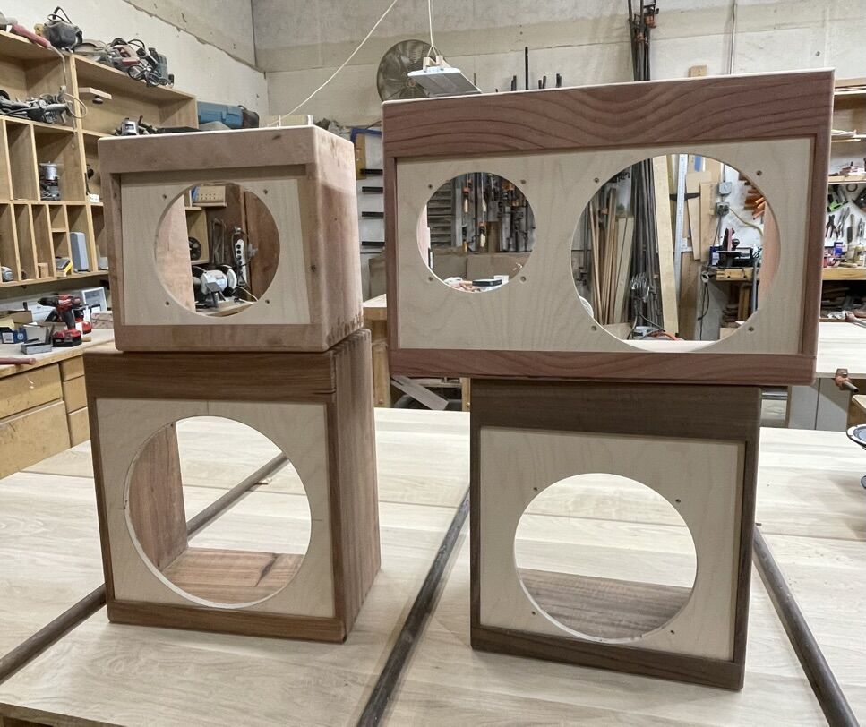 Cabinets with speaker baffles cut for different sizes