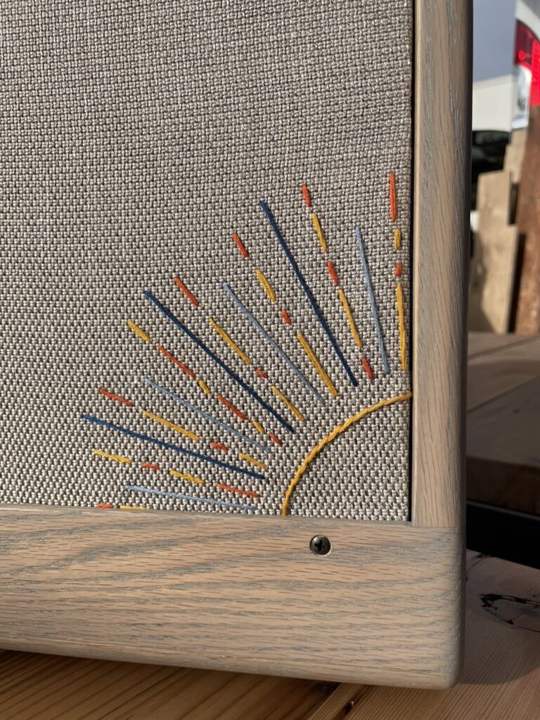 Multicolour sunburst rays stitched on wheat grill cloth