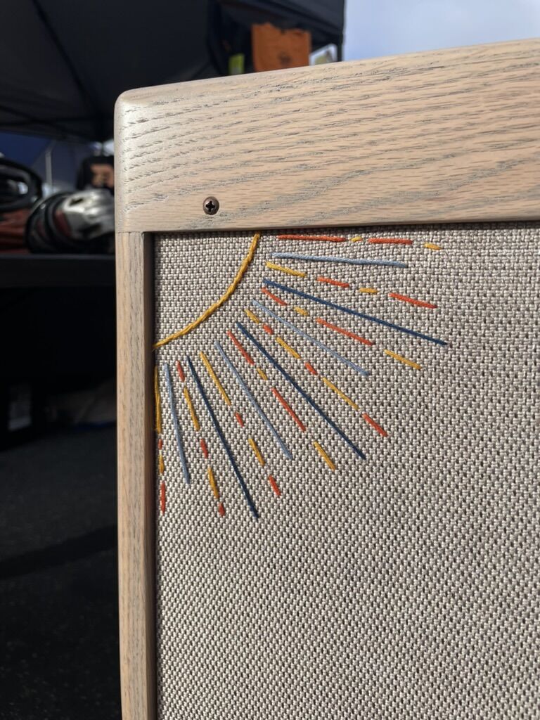 Gold sunburst stitched in a cabinet corner