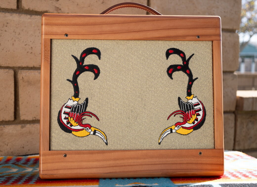 Redwood cabinet with embroidered toucans