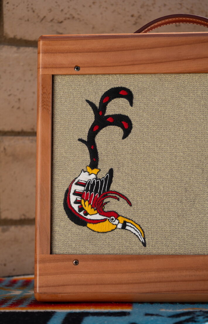 Redwood cabinet with a single toucan