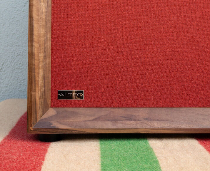 Walnut cabinet with red grill cloth and an Altec badge